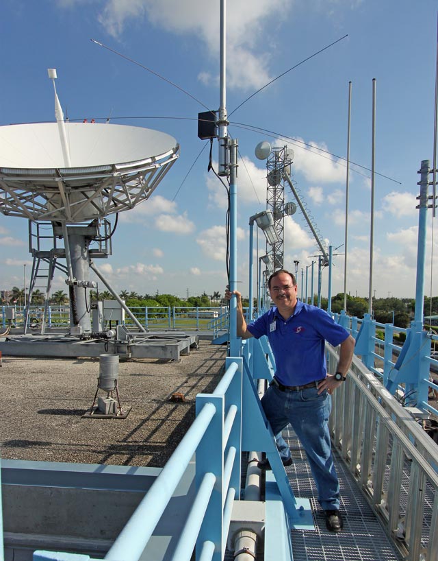 WX4NHC Assistant Coordinator Julio Ripoll-WD4R Inspecting Antennas on Top of the NHC
